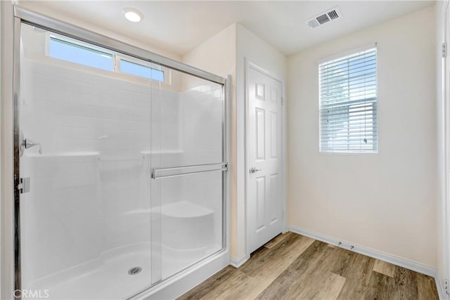 9126 Foster Ln, Chatsworth, CA 91311 - bathroom with baseboards, wood finished floors, and a shower stall