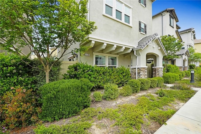 9126 Foster Ln, Chatsworth, CA 91311 - view of front facade featuring stucco siding and stone siding