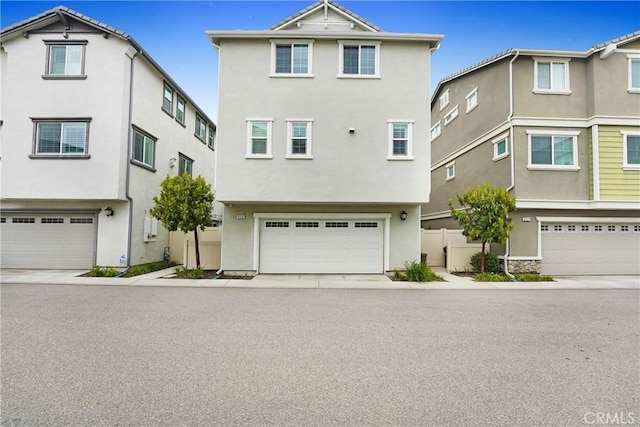9126 Foster Ln, Chatsworth, CA 91311 - view of front facade featuring stucco siding and a garage