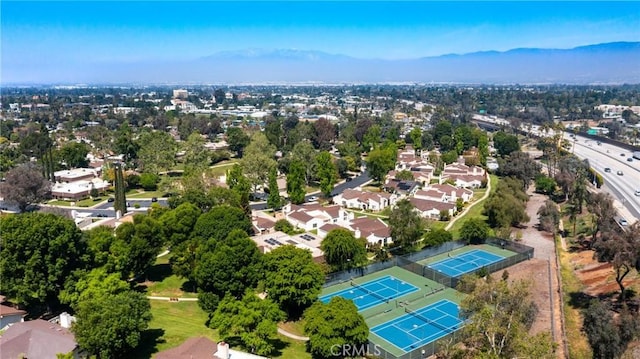 birds eye view of property with a mountain view