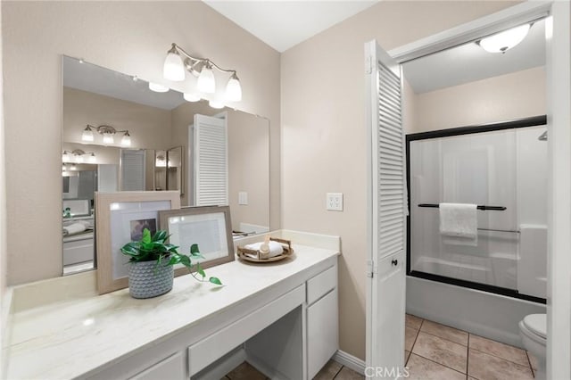 full bath featuring toilet, tile patterned flooring, shower / bathtub combination, and vanity