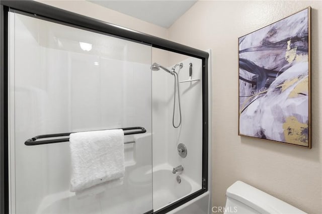 full bathroom featuring enclosed tub / shower combo and toilet