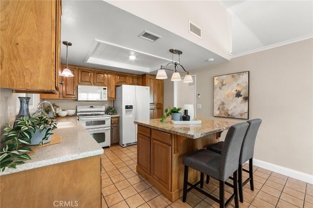 kitchen featuring light tile patterned floors, visible vents, and white appliances