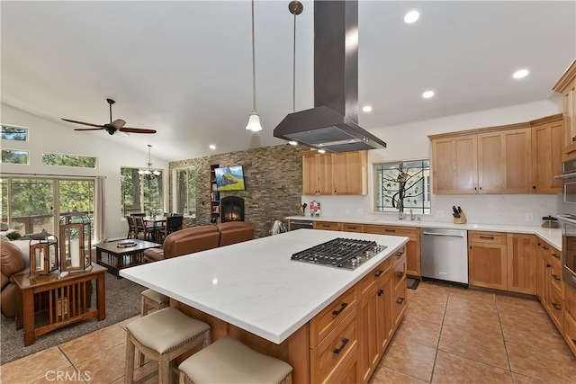 39080 Waterview Dr, Big Bear Lake, CA 92315 - kitchen featuring appliances with stainless steel finishes, island exhaust hood, a ceiling fan, light tile patterned flooring, and tasteful backsplash