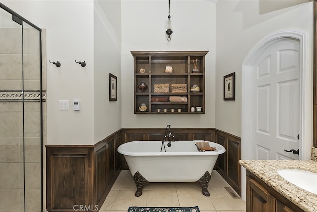 39080 Waterview Dr, Big Bear Lake, CA 92315 - full bath featuring a freestanding bath, wainscoting, vanity, tile patterned floors, and a tile shower