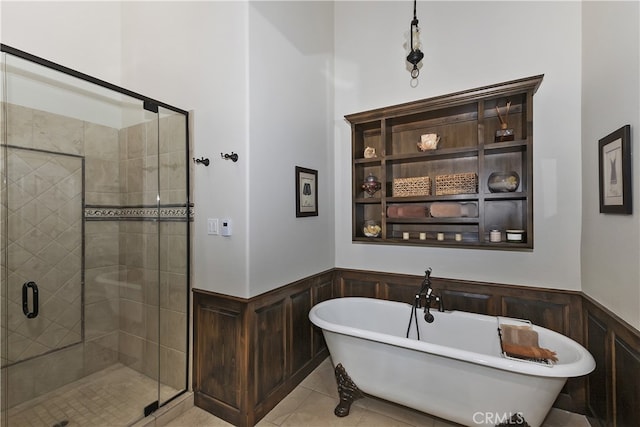 39080 Waterview Dr, Big Bear Lake, CA 92315 - full bath with a wainscoted wall, a stall shower, a freestanding bath, tile patterned floors, and a decorative wall