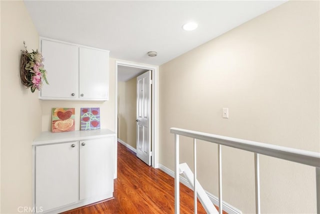 hall with baseboards, recessed lighting, and wood finished floors
