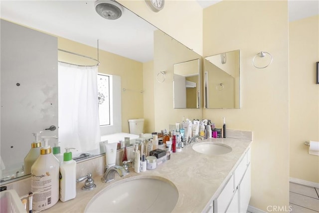 full bathroom featuring double vanity, a sink, tile patterned flooring, and a shower with curtain