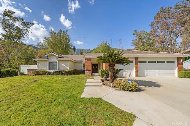 single story home featuring an attached garage, driveway, a front yard, and stucco siding
