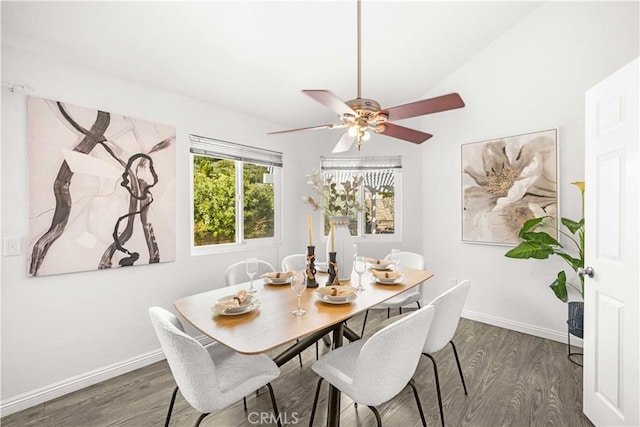 dining area with dark wood-type flooring, a ceiling fan, and baseboards