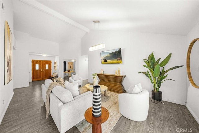 living area with baseboards, beamed ceiling, wood finished floors, and high vaulted ceiling