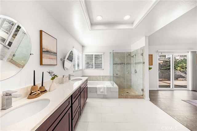 bathroom with a sink, a wealth of natural light, and a shower stall