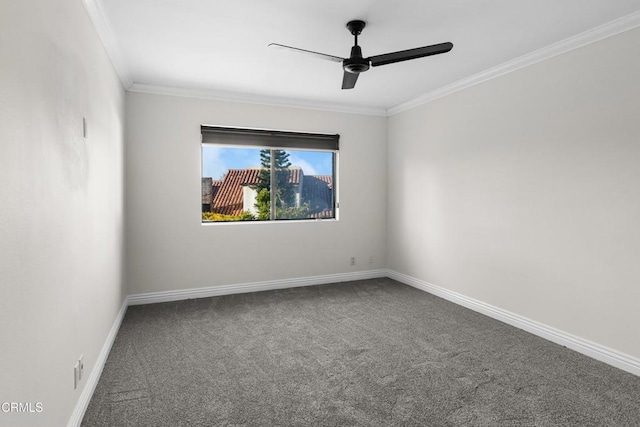 carpeted empty room featuring baseboards, ceiling fan, and crown molding