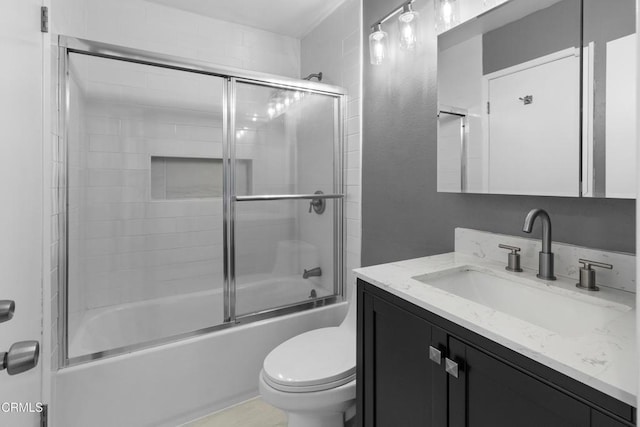 bathroom featuring shower / bath combination with glass door, toilet, and vanity