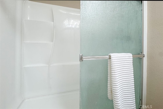 full bath with an enclosed shower
