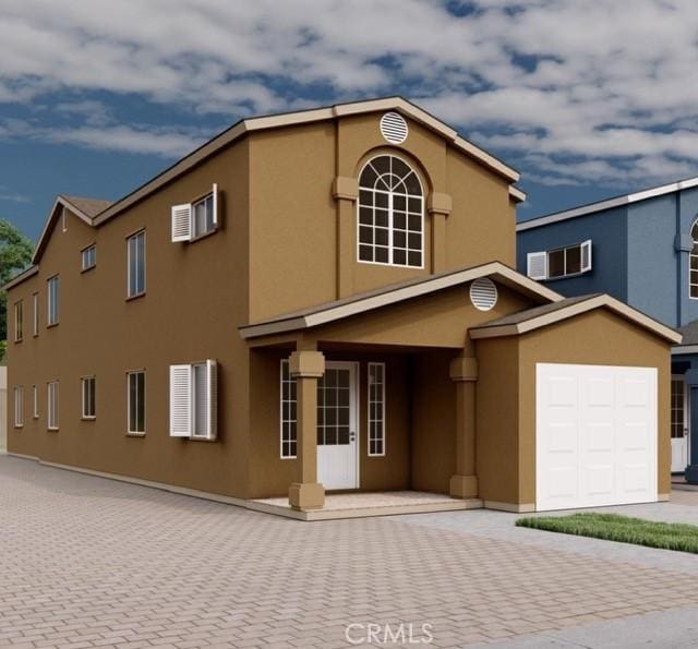 22020 Pioneer Blvd Unit A & B, Hawaiian Gardens, CA 90716 - view of front of house featuring stucco siding, driveway, a wall mounted AC, and an attached garage
