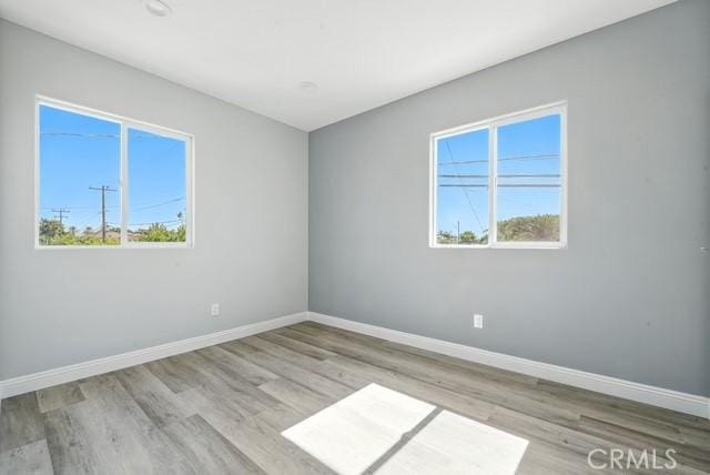 22020 Pioneer Blvd Unit A & B, Hawaiian Gardens, CA 90716 - spare room with baseboards and wood finished floors