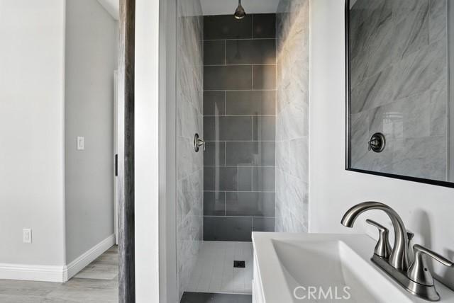 22020 Pioneer Blvd Unit A & B, Hawaiian Gardens, CA 90716 - bathroom with a tile shower and vanity