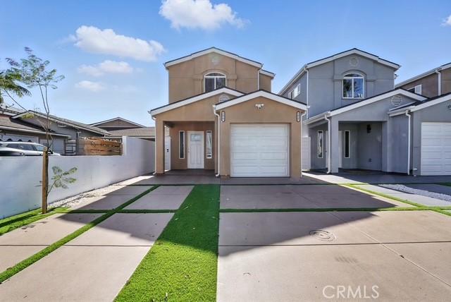 22020 Pioneer Blvd Unit A & B, Hawaiian Gardens, CA 90716 - traditional-style home with driveway, stucco siding, and a garage
