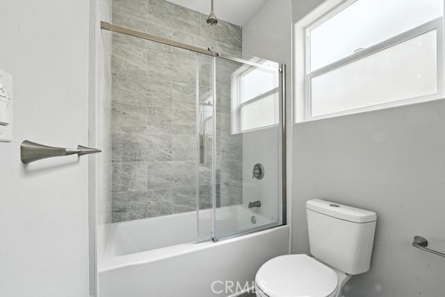 22020 Pioneer Blvd Unit A & B, Hawaiian Gardens, CA 90716 - bathroom featuring enclosed tub / shower combo and toilet
