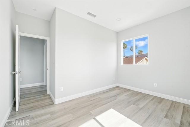 22020 Pioneer Blvd Unit A & B, Hawaiian Gardens, CA 90716 - unfurnished room with light wood-style floors and baseboards