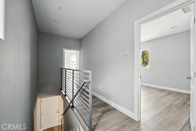 22020 Pioneer Blvd Unit A & B, Hawaiian Gardens, CA 90716 - stairway with wood finished floors and baseboards
