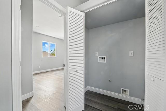 22020 Pioneer Blvd Unit A & B, Hawaiian Gardens, CA 90716 - washroom with hookup for a washing machine and wood finished floors