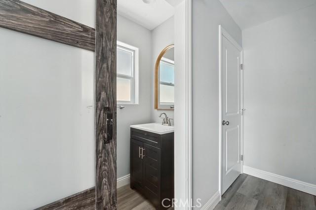 22020 Pioneer Blvd Unit A & B, Hawaiian Gardens, CA 90716 - bathroom featuring wood finished floors and vanity