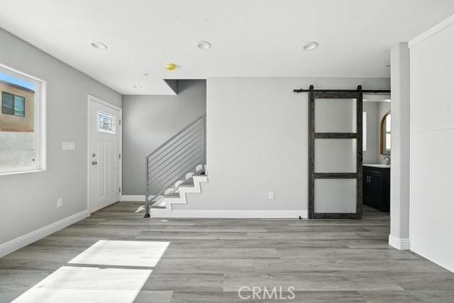 22020 Pioneer Blvd Unit A & B, Hawaiian Gardens, CA 90716 - entrance foyer with wood finished floors, stairway, a barn door, and recessed lighting