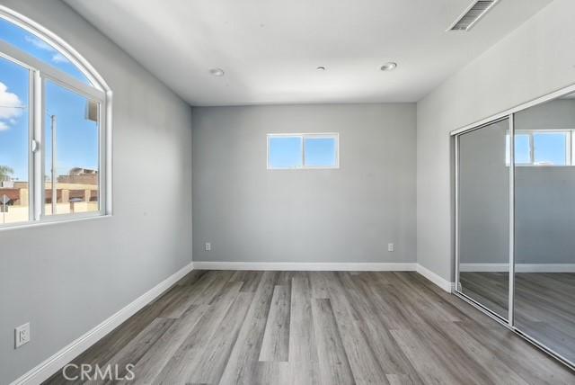 22020 Pioneer Blvd Unit A & B, Hawaiian Gardens, CA 90716 - unfurnished bedroom with wood finished floors, a closet, and recessed lighting