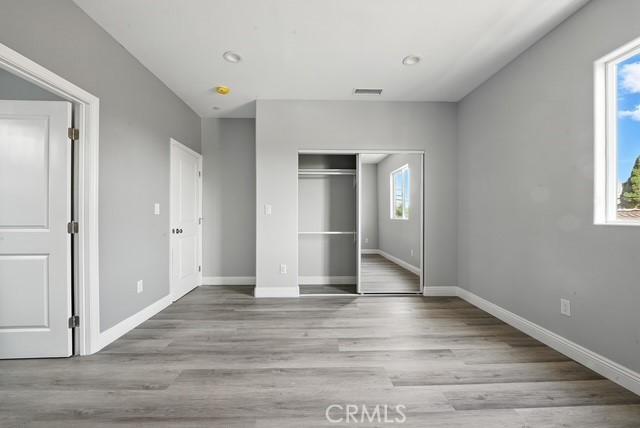 22020 Pioneer Blvd Unit A & B, Hawaiian Gardens, CA 90716 - unfurnished bedroom with wood finished floors and a closet
