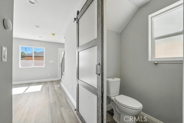 22020 Pioneer Blvd Unit A & B, Hawaiian Gardens, CA 90716 - bathroom featuring wood finished floors and lofted ceiling