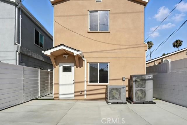 22020 Pioneer Blvd Unit A & B, Hawaiian Gardens, CA 90716 - rear view of house featuring stucco siding and a patio area