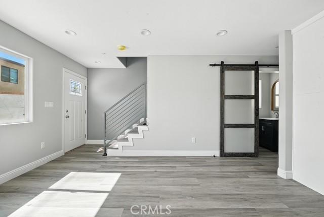 22020 Pioneer Blvd Unit A & B, Hawaiian Gardens, CA 90716 - entryway featuring wood finished floors, stairs, a barn door, and recessed lighting