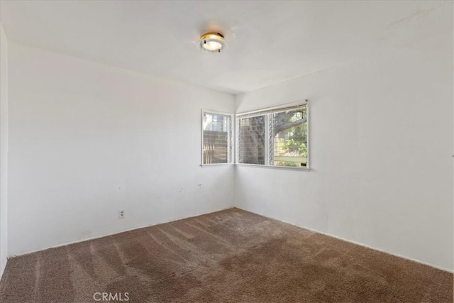 empty room with carpet flooring