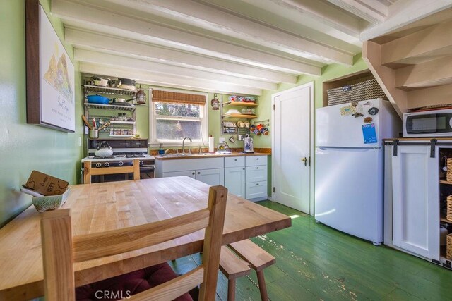 32950 Canyon Dr, Green Valley Lake, CA 92341 - kitchen with open shelves, beamed ceiling, a sink, freestanding refrigerator, and wood finished floors