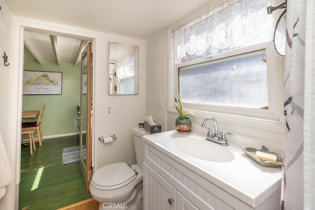 32950 Canyon Dr, Green Valley Lake, CA 92341 - bathroom with toilet, wood finished floors, vanity, and baseboards