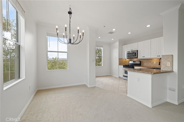 kitchen featuring crown molding, light colored carpet, white cabinets, tasteful backsplash, and appliances with stainless steel finishes