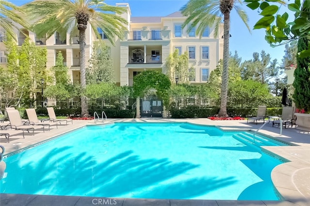community pool with a patio