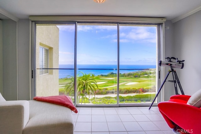 sitting room featuring a water view and light tile patterned floors