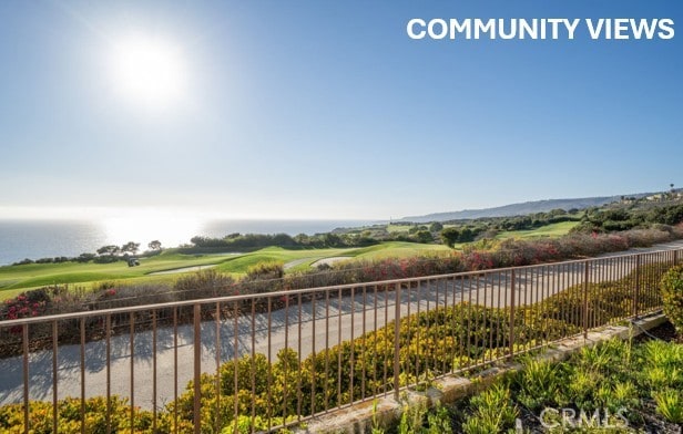 exterior space with view of golf course and fence