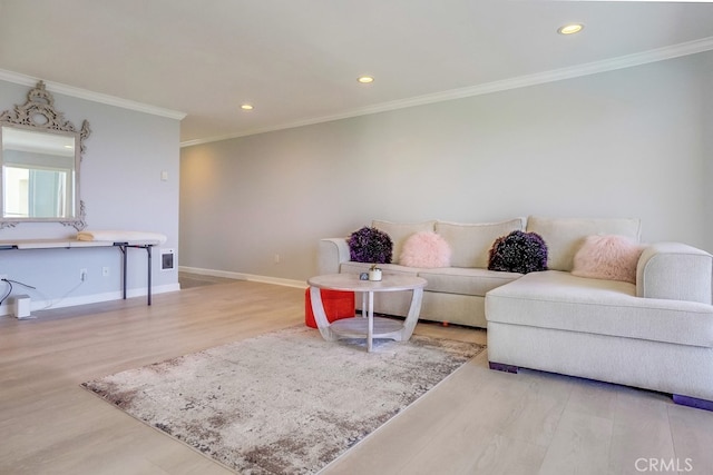 living room with baseboards, ornamental molding, recessed lighting, and wood finished floors
