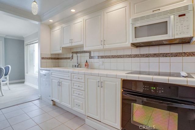 kitchen with ornamental molding, white cabinetry, a sink, backsplash, and black appliances