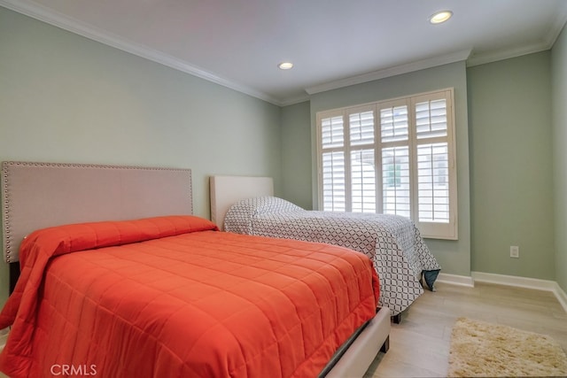 bedroom with recessed lighting, baseboards, ornamental molding, and wood finished floors