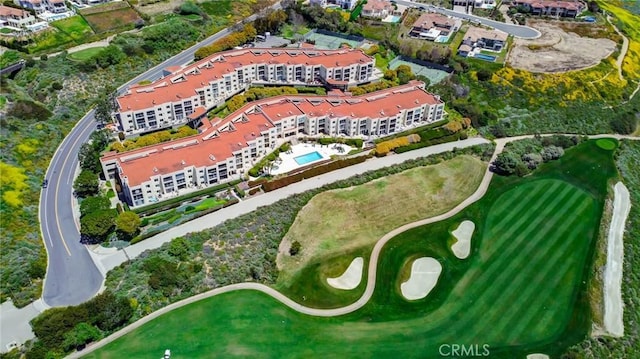 birds eye view of property with golf course view