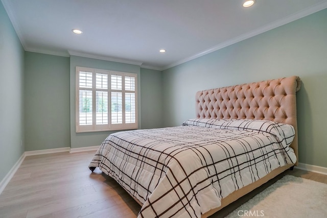 bedroom featuring baseboards, recessed lighting, and wood finished floors