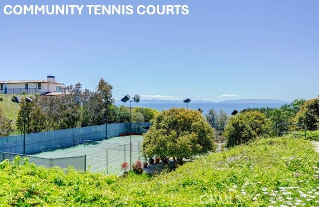 view of sport court featuring fence
