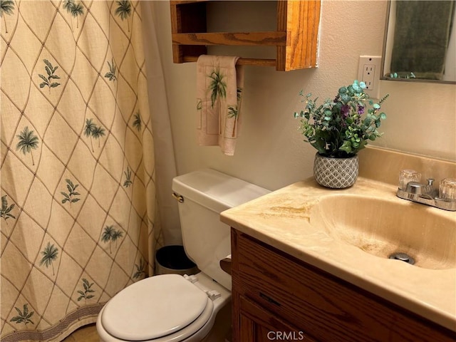 full bathroom with vanity and toilet
