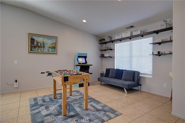 game room featuring light tile patterned floors, visible vents, baseboards, recessed lighting, and vaulted ceiling