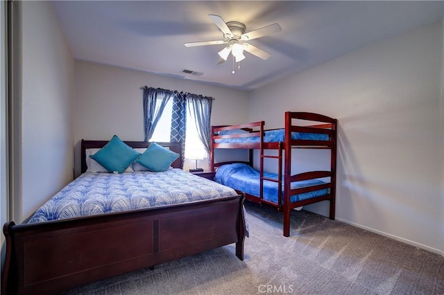 bedroom featuring baseboards, visible vents, ceiling fan, and carpet flooring